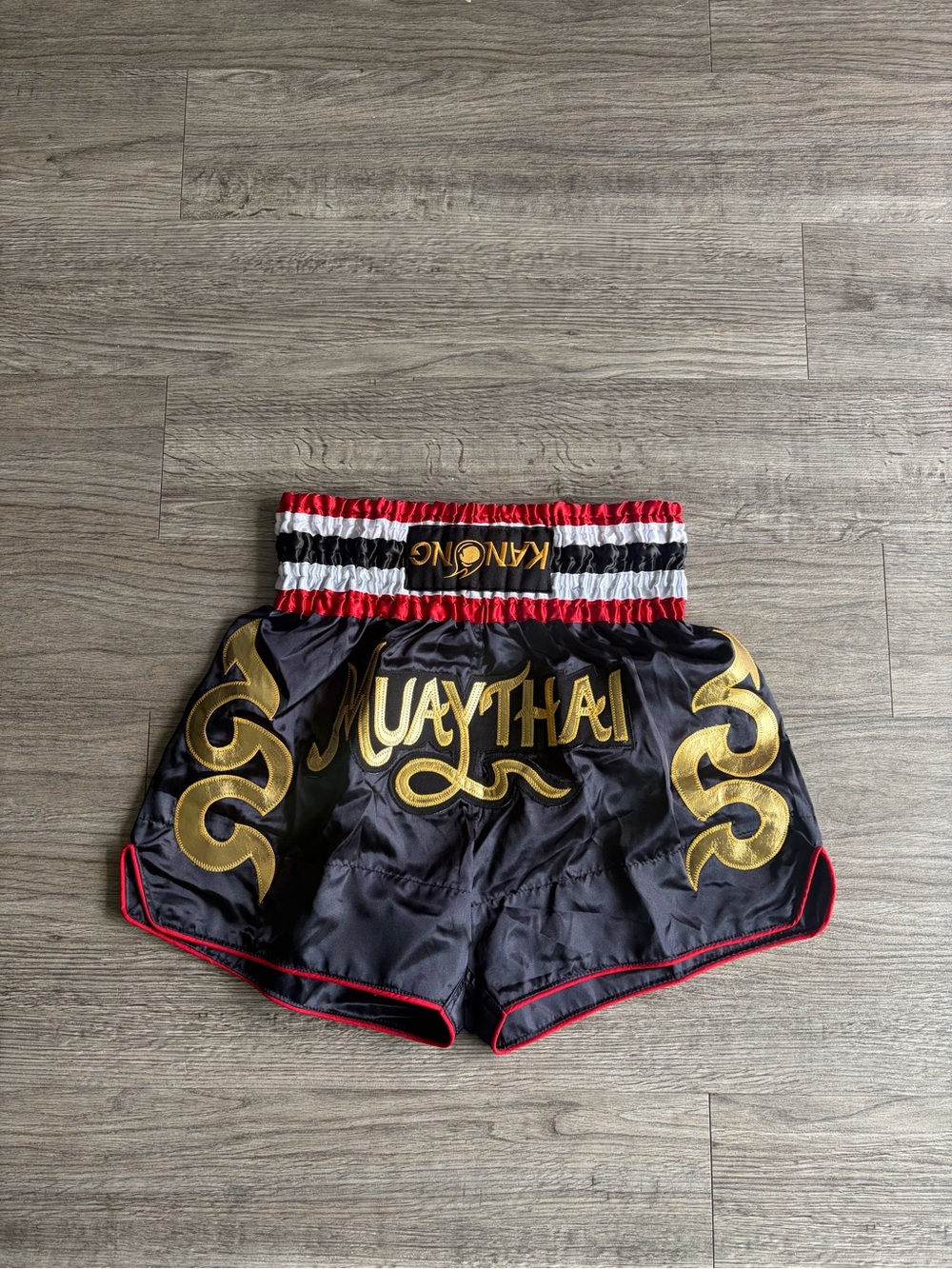 Muay Thai Satin Training Shorts in Black with Gold